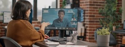 business-woman-having-discussion-with-man-video-call-desk-entrepreneur-using-online-remote-conference-computer-talk-colleague-about-project-planning-presentation_482257-43823