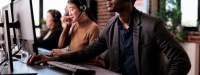 operator-answering-client-phone-call-customer-care-service-helping-people-call-center-support-male-receptionist-giving-telemarketing-assistance-phone-helpline-office_482257-47212